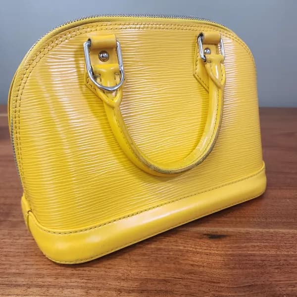 Louis Vuitton Alma Yellow Epi Leather Handbag, detail view