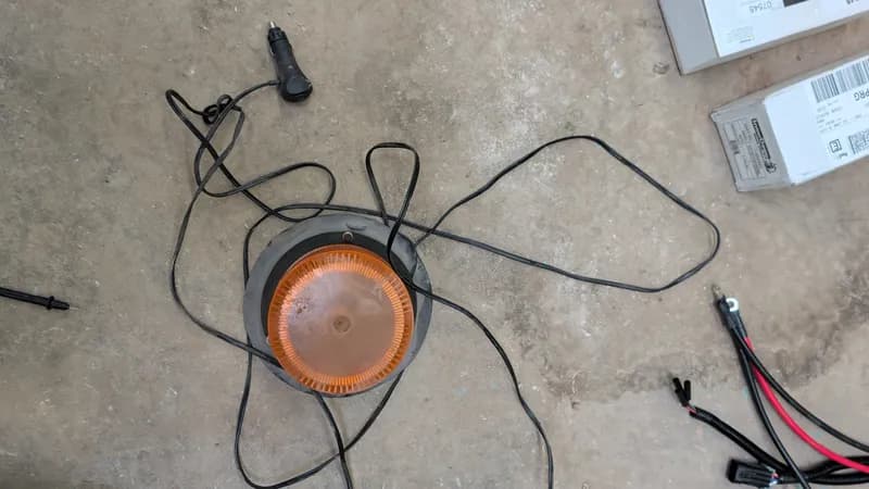 Orange LED Warning Light w/ Black Mounting Bracket, side view