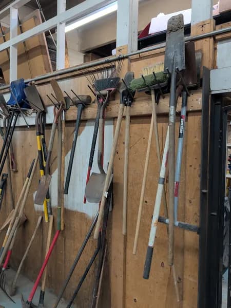 Lot of Landscaping Hand Tools with Wall Mount, side view