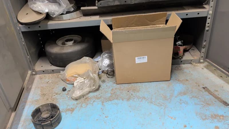 Lawn Equipment Parts & Accessories Lot with Metal Shelf - Cabinet not included, close-up view