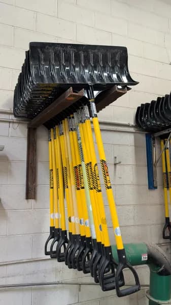 Lot of 15 Snow Shovels with Wall-Mount Rack Storage, primary view