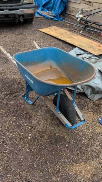 Blue Steel Wheelbarrow w/ Wooden Handles, side view
