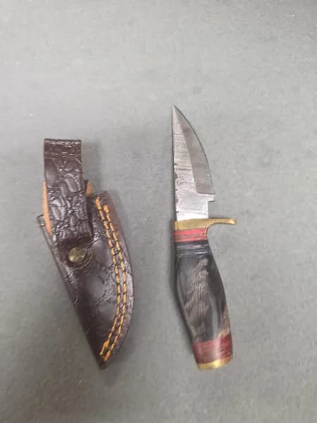 Fixed Blade Knife w/ Patterned Blade, Brass Guard, Wood Handle & Leather Sheath, detail view
