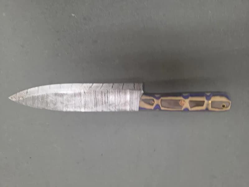 Fixed Blade Knife with Damascus-Style Patterned Blade and Blue Laminate Handle, side view
